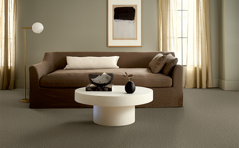 warm toned hardwood flooring in hallway.