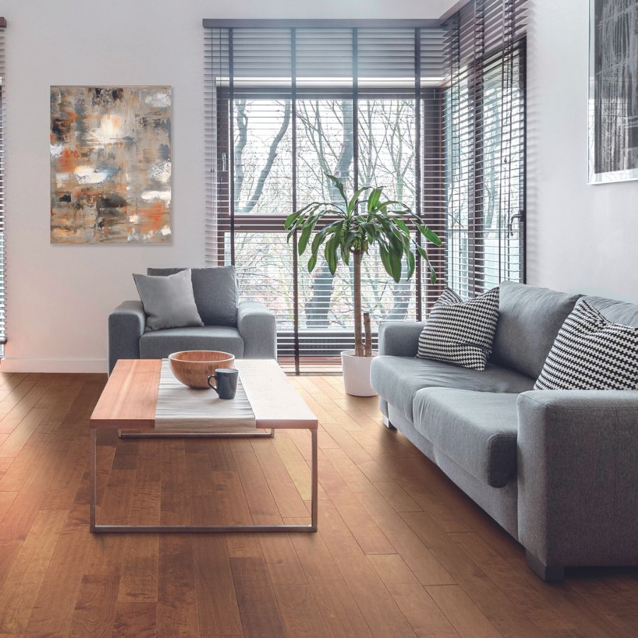 Hardwood flooring in living room, grey couch